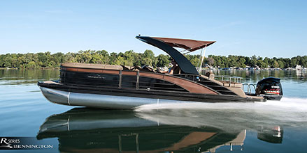 Pontoon speeding on a lake