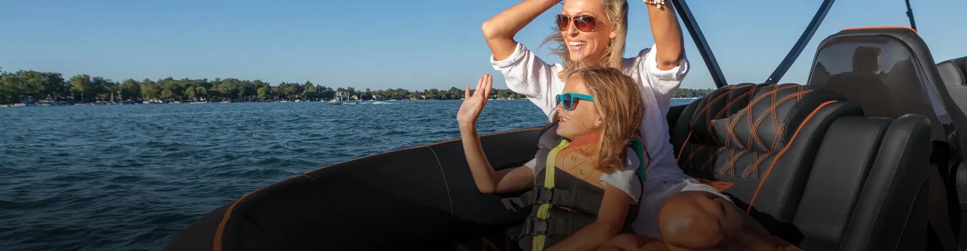Mother and daughter smile while sitting on ergonomically designed Bennington seating. 