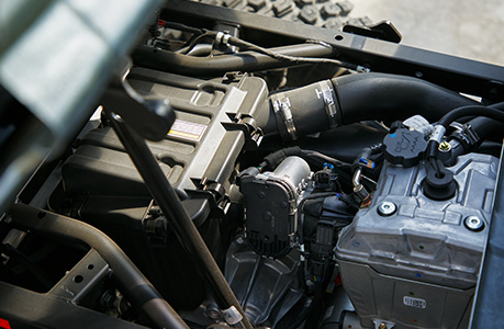 Overhead view of the reliable engine in a Polaris Pro XD work UTV.