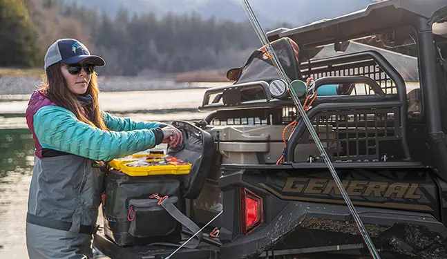 A woman waiting for fishing in her General XP 1000
