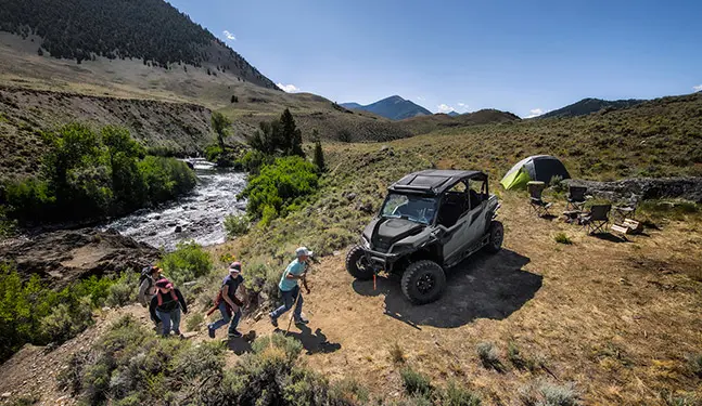 Long Shot of a General XP 1000 and a hiking group