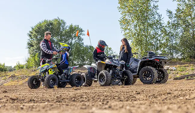 A family preparing to ride