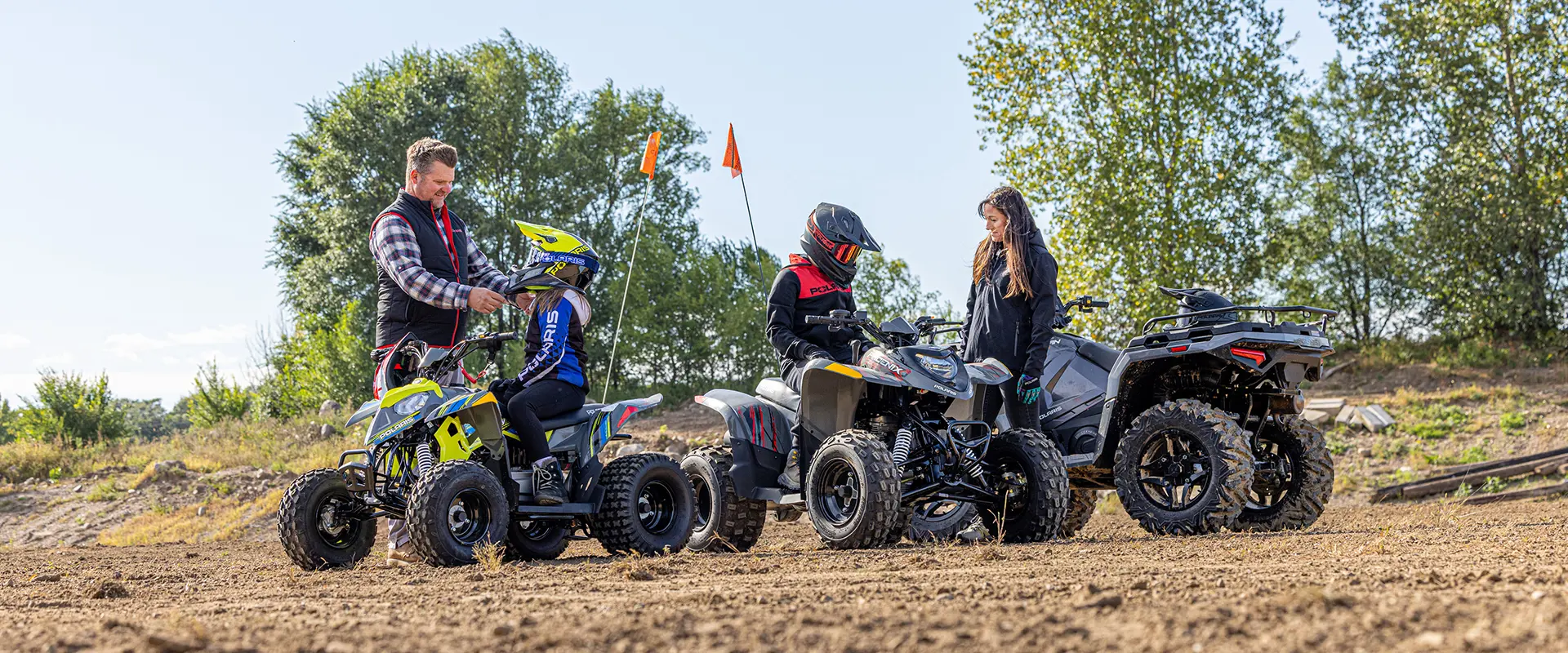 A family preparing to ride