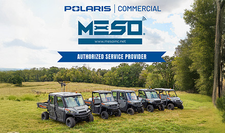 A lineup of Polaris Commercial vehicles placed in a grassy field with the Polaris Commercial and M.E.S.O., Inc. logos at the top.