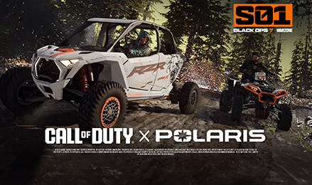 Call of Duty x Polaris collaboration, featuring a white Polaris RZR Pro R SxS with a driver and a Polaris ATV, both in a rugged, forested game-like environment with S01 BLACK OPS 7 WARZONE branding.