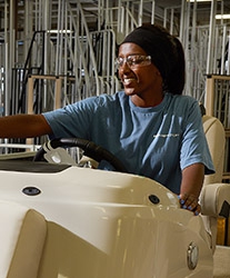 A Bennington Boats employee working on a boat