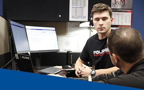 A Customer Service employee working at a Polaris office