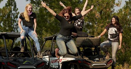 Polaris RZR riders posing for a picture
