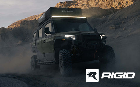 Polaris XPEDITION ADV 4-Seat UTV with Rigid lighting accessories in a desert landscape.