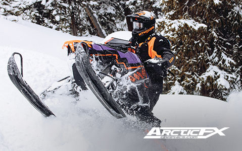 Rider on a Polaris Snowmobile with ArcticFX Graphics kit in deep snow.
