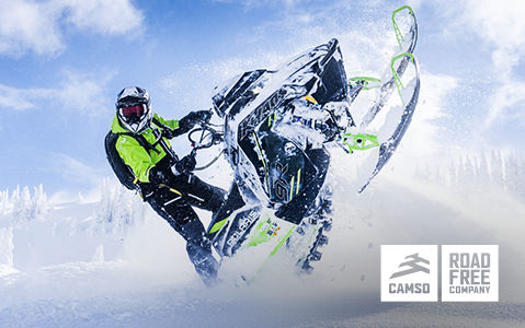 Rider on a Polaris Snowmobile with Camso Road Free Company gear.