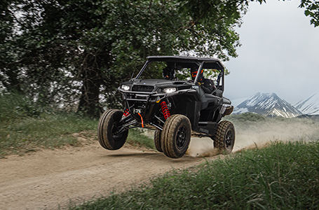 A Polaris GENERAL vehicles on the road