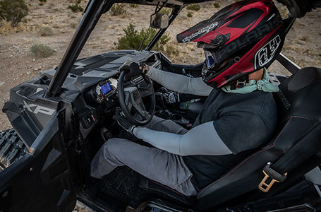 A Polaris GENERAL being driven on the mountains
