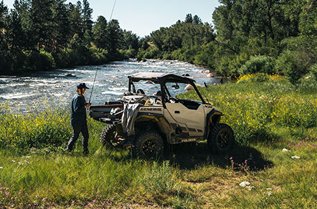 A man taking his Polaris GENERAL to fishing