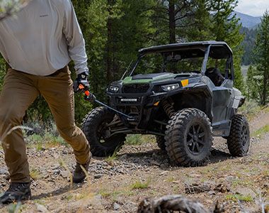 RZR 570 going down a green trail road