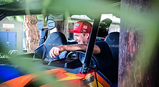 Troy Lee riding in the cab of the Polaris General XP 1000 Troy Lee Designs Edition side by side