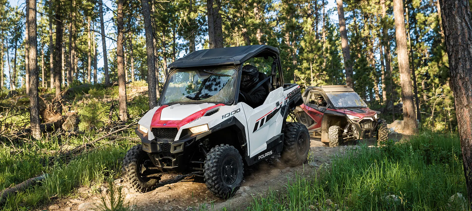 white general 1000 side by side leading a RZR on a trail