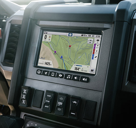 Interior of a Polaris GENERAL UTV, showing the RIDE COMMAND display with a trail map and vehicle information, along with the steering wheel and dashboard.
