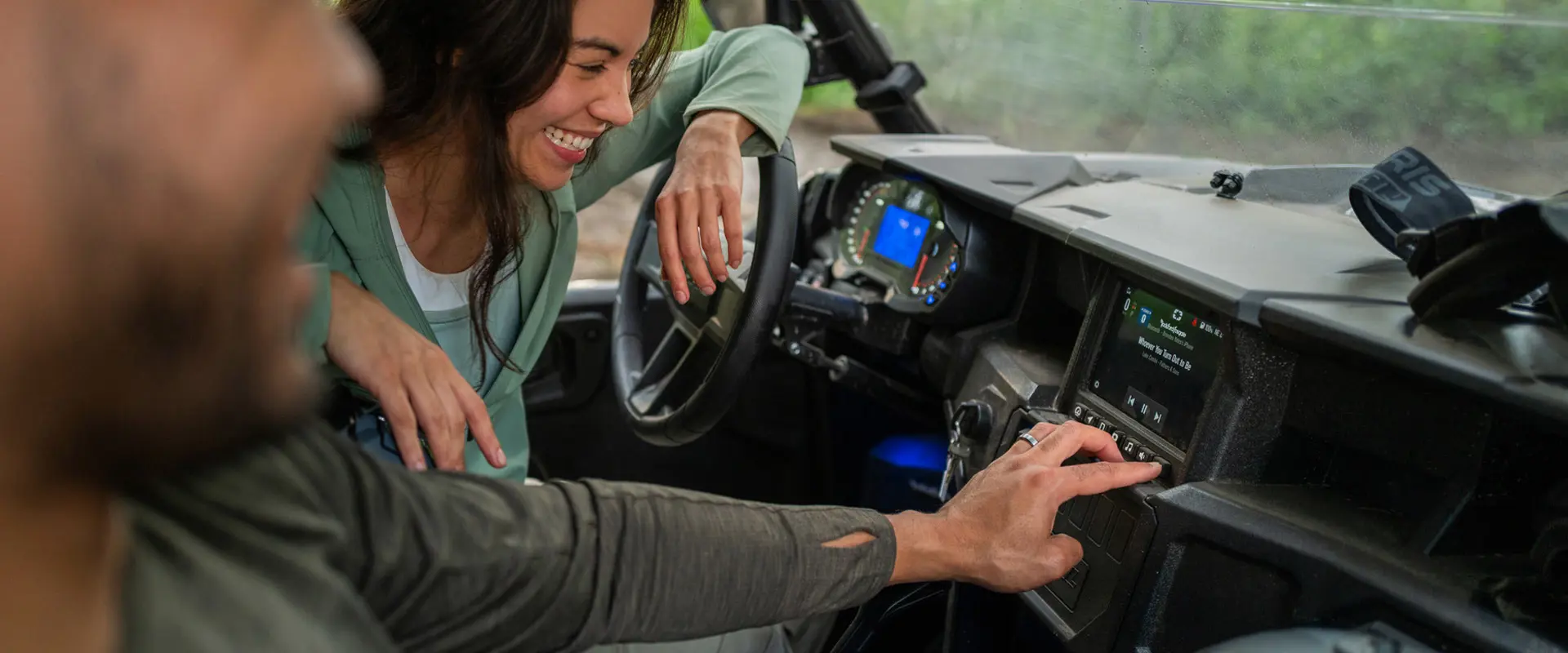 Closeup of the front end and illuminated headlights of a 2026 Polaris GENERAL XP 1000 crossover side-by-side.