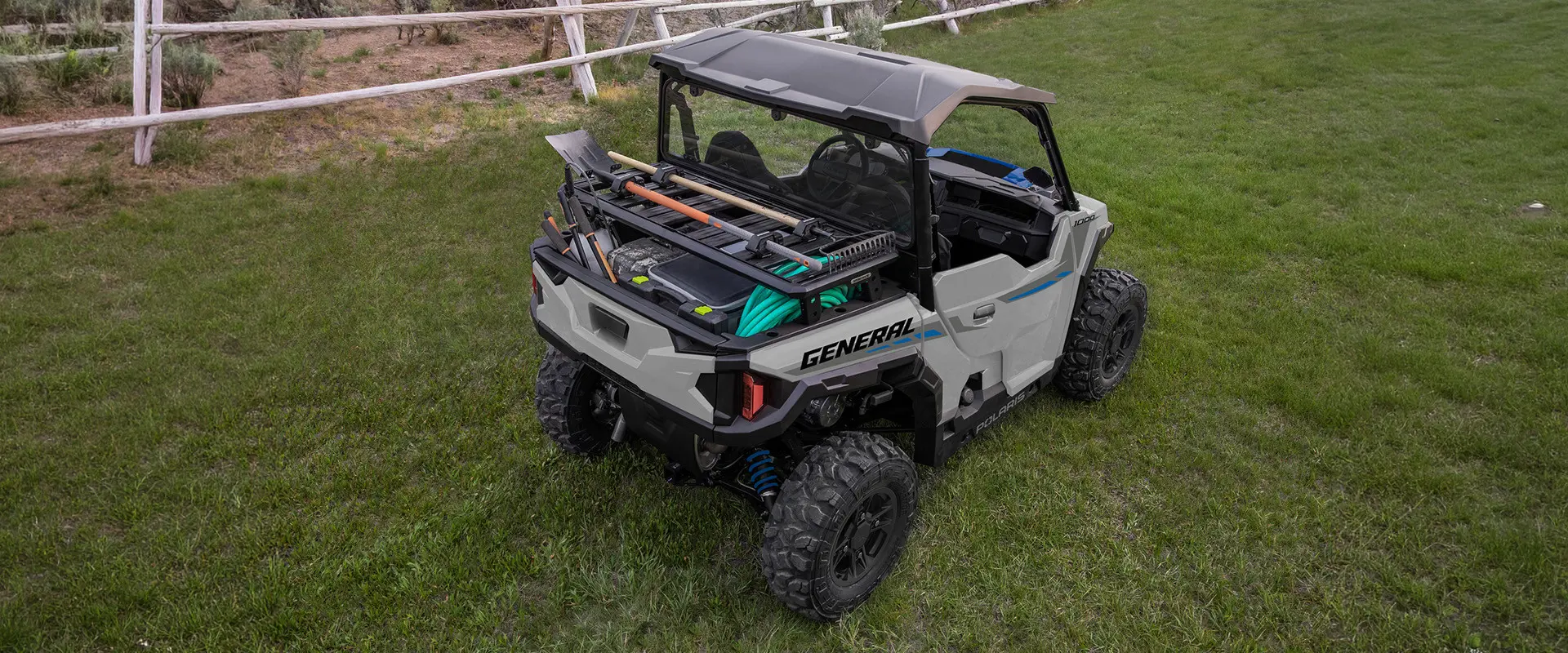 Aerial view of the cargo box with a cargo rack accessory on a 2027 Polaris GENERAL 1000 side-by-side.