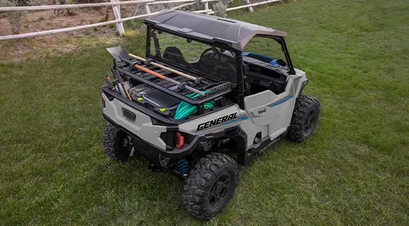 Aerial view of the cargo box with a cargo rack accessory on a 2027 Polaris GENERAL 1000 side-by-side.