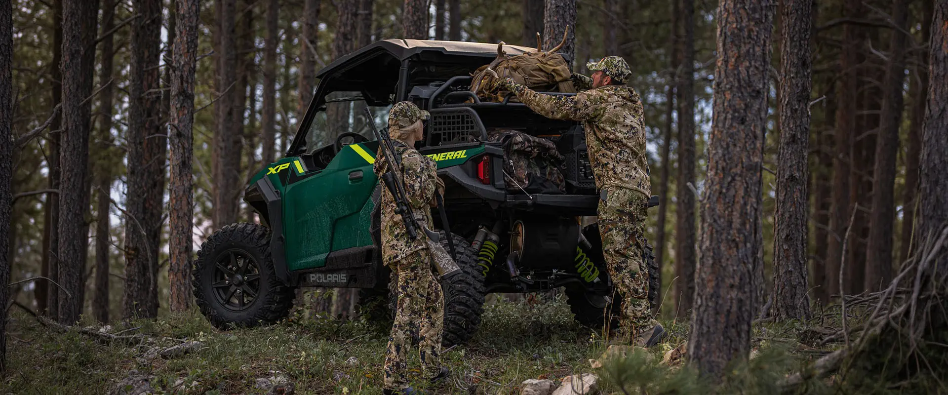 2 hunters unloaded gear from a cargo rack on a 2027 Polaris GENERAL XP 1000 SxS.
