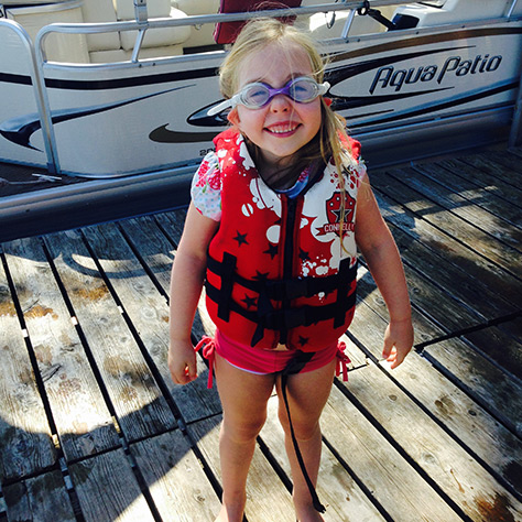 Child ready to get on a boat