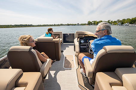 family sitting comfortably on a godfrey split bench pontoon