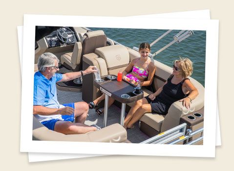 family relaxing on a godfrey aquapatio split bench pontoon