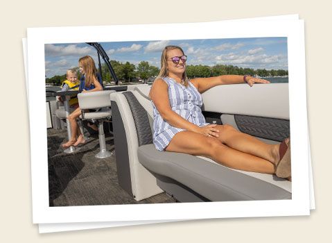 family relaxing on a godfrey monaco entertainment pontoon