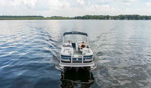 bow view of a godfrey sweetwater entertainment pontoon on a lake
