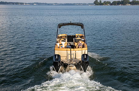 family relaxing in the ultra lounge seating on a godfrey lounge pontoon