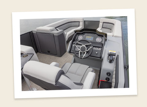 captain's chair and helm on a godfrey aquapatio entertainment pontoon