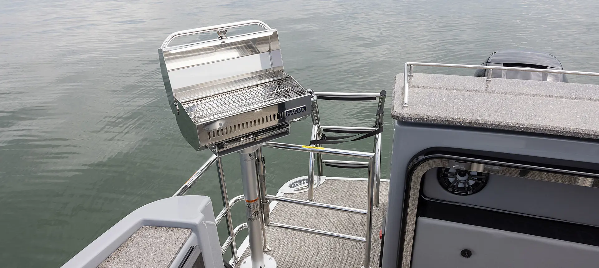 Stainless steel removable grill on a Godfrey AquaPatio Entertainment pontoon boat.