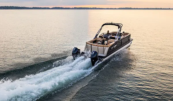 godfrey aquapatio lounge pontoon driving at sundown