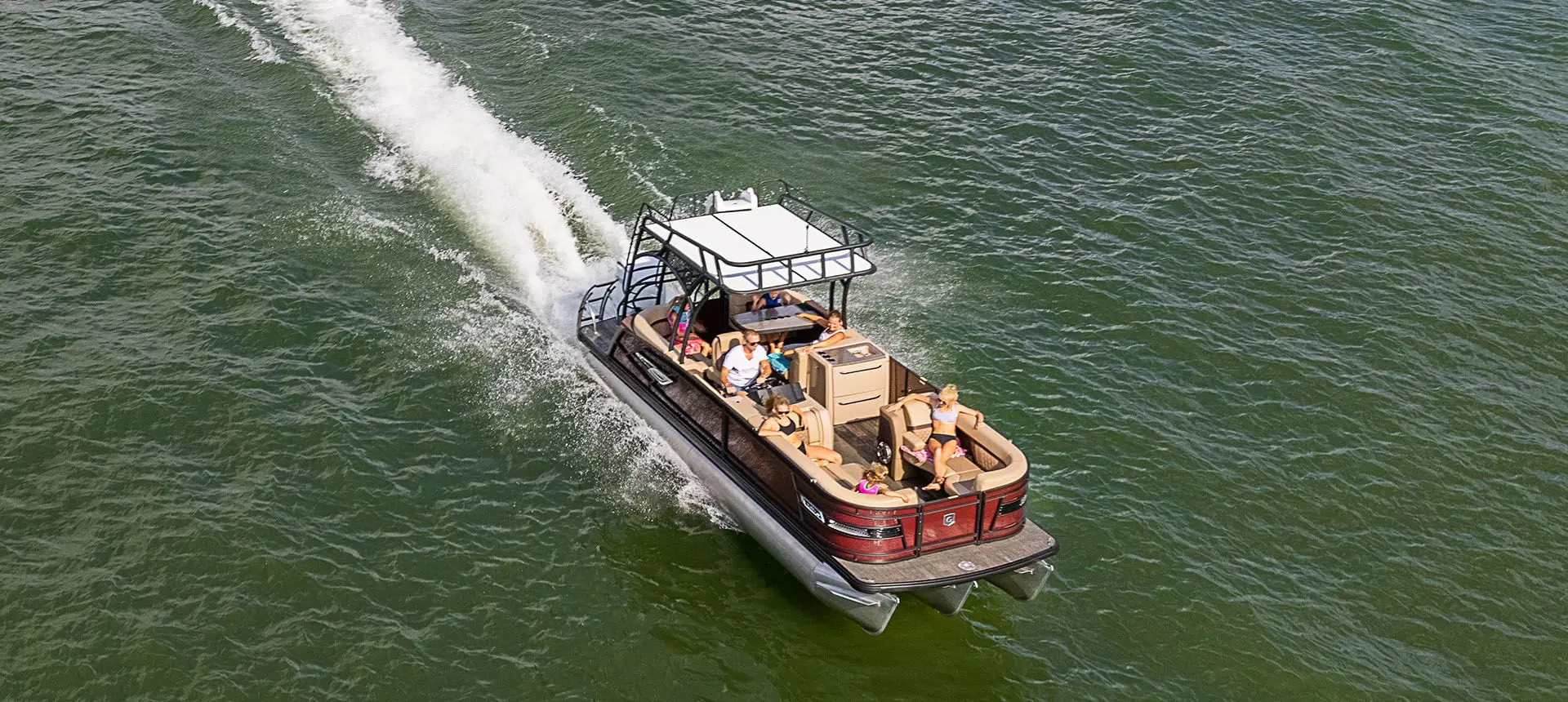 godfrey monaco split bench pontoon with sundeck on a lake