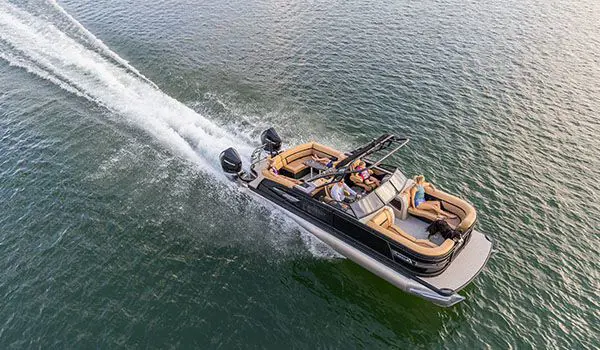 godfrey aquapatio windshield pontoon speeding across a lake