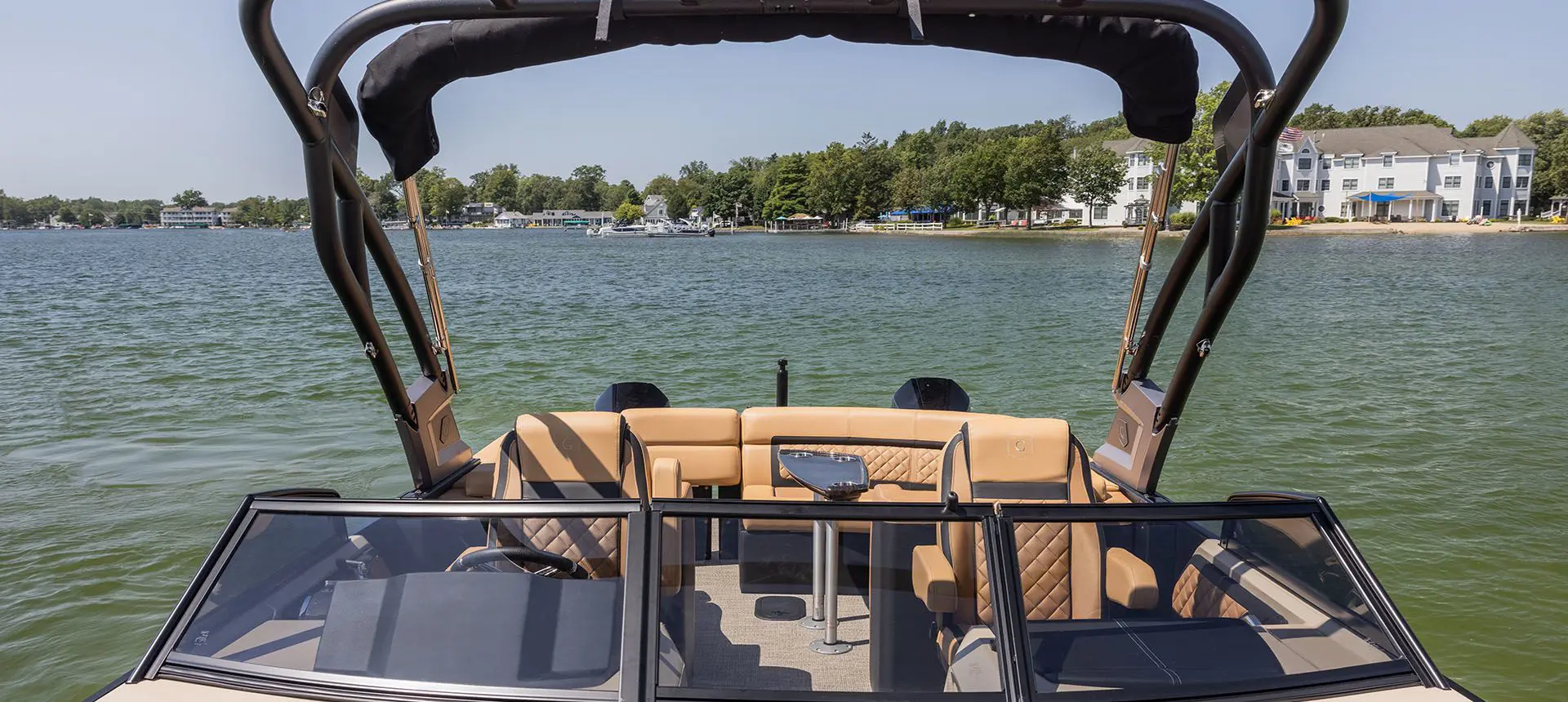 windshield and co-captain's chairs on a godfrey aquapatio winshield pontoon
