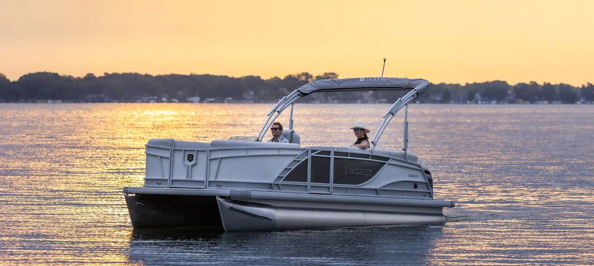 godfrey monaco cruise pontoon floating at sunset