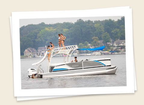 family enjoying the sun on a godfrey monaco sundeck pontoon
