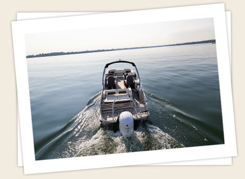 godfrey sanpan lounge pontoon speeding on a lake
