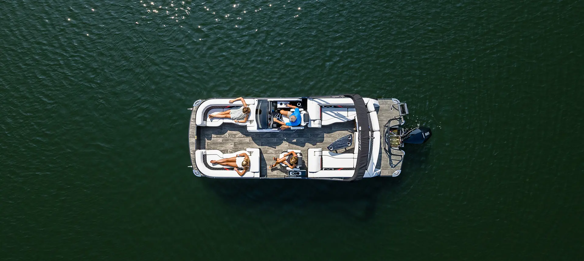 top view of a fully loaded godfrey sanpan lounge pontoon