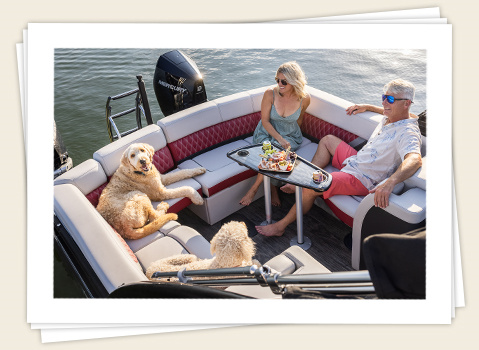 family sitting in the stern u-lounge on a godfrey sanpan twin pontoon