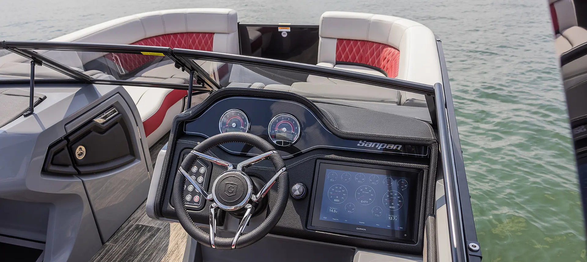 digital gauges and garmin gps at the helm on a godfrey sanpan twin tritoon