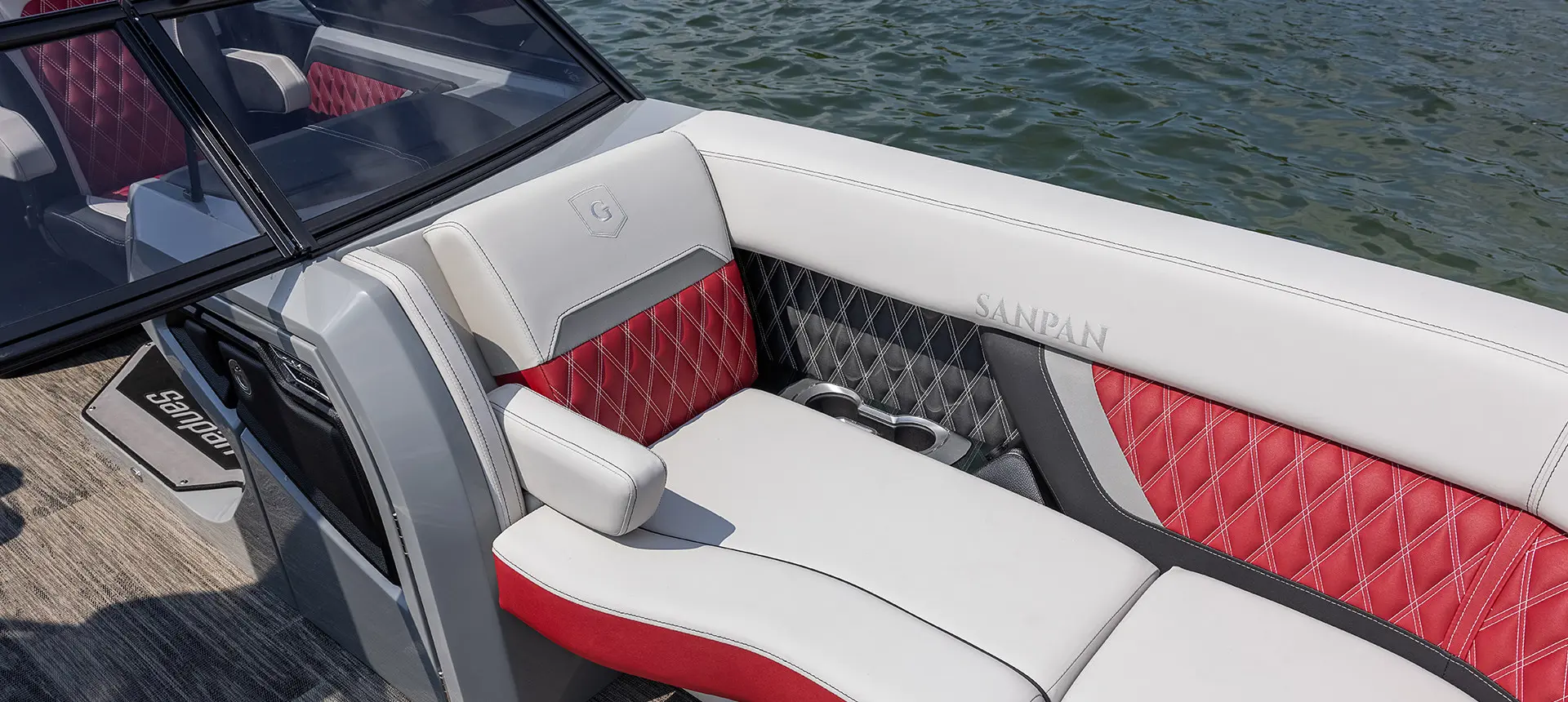 premium stitching on the split bench seats on a godfrey sanpan windshield pontoon