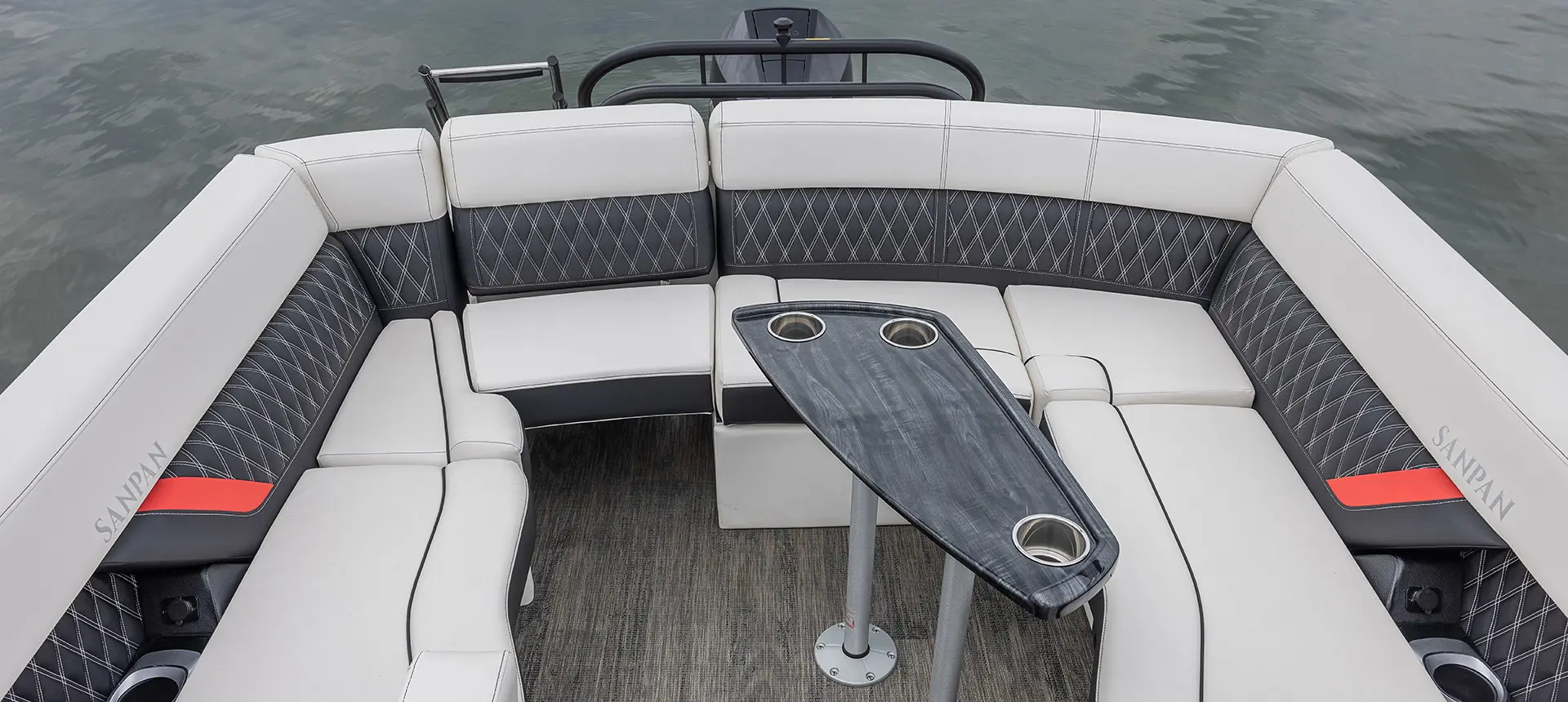 stern ultra lounge with table on a godfrey sanpan windshield pontoon