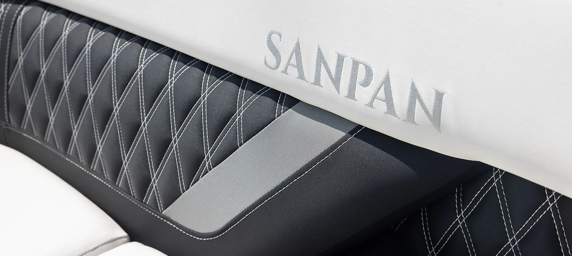 closeup of the premium seat stitching on a godfrey sanpan windshield pontoon