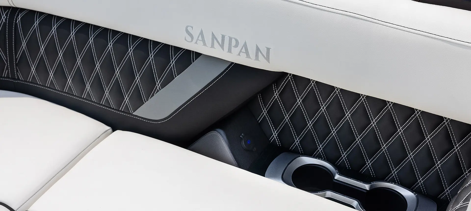 integrated cupholders and in-seat 12 volt plug in on a godfrey sanpan windshield pontoon