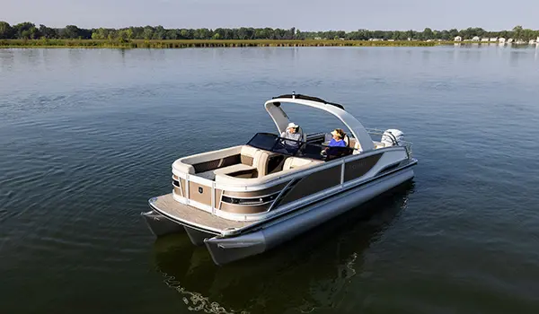 godfrey sanpan windshield pontoon floating on a lake