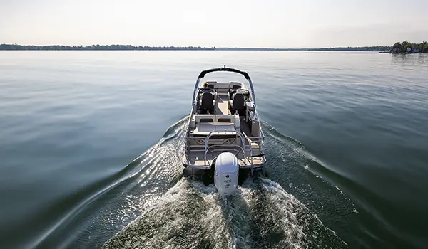 godfrey sanpan windshield pontoon cruising on a lake